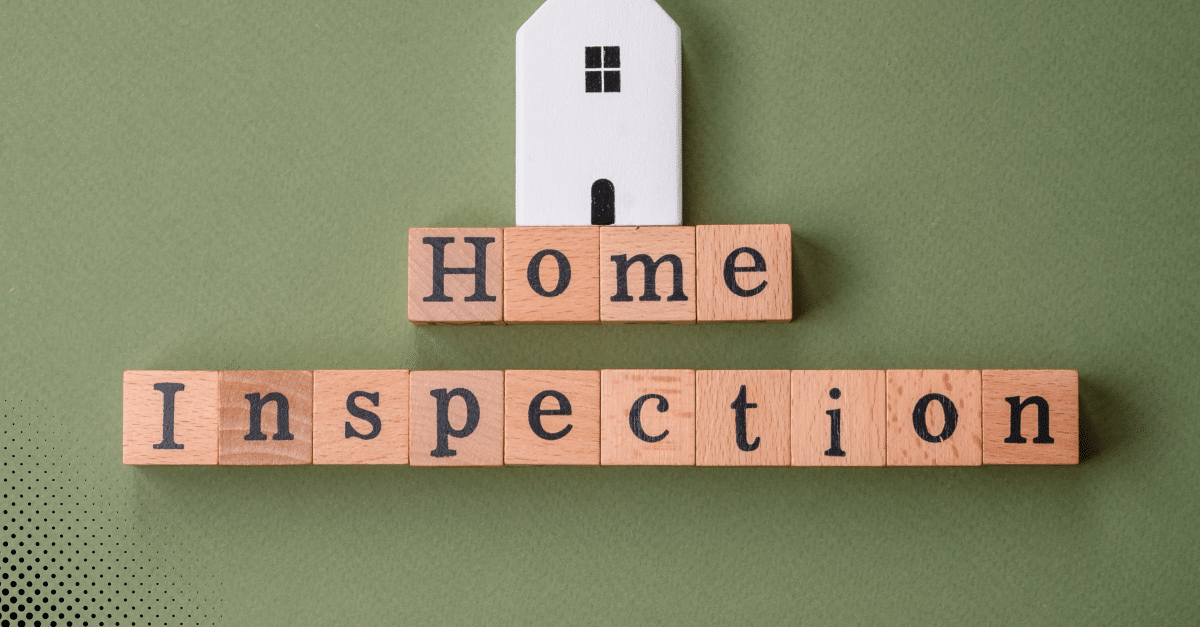 Wooden blocks spelling out Home Inspection with a small house on top.