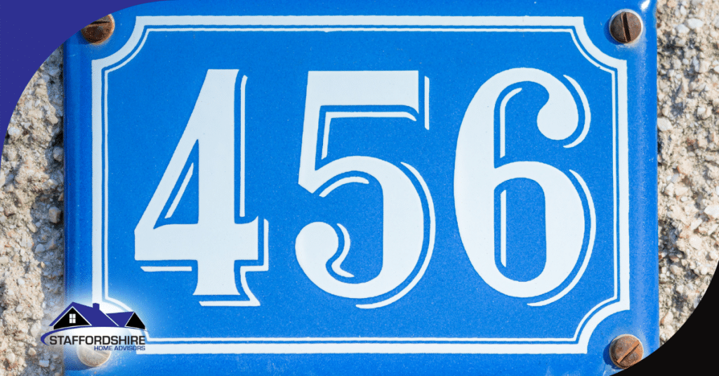 Blue metal plaque showing house number 456 with white numbers.