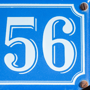 Blue metal plaque showing house number 456 with white numbers.