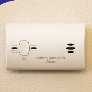 Carbon monoxide alarm mounted on a wall.