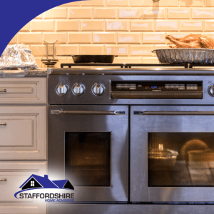 Roasted turkey resting on a stove with dishes baking inside the oven in a well-lit kitchen.